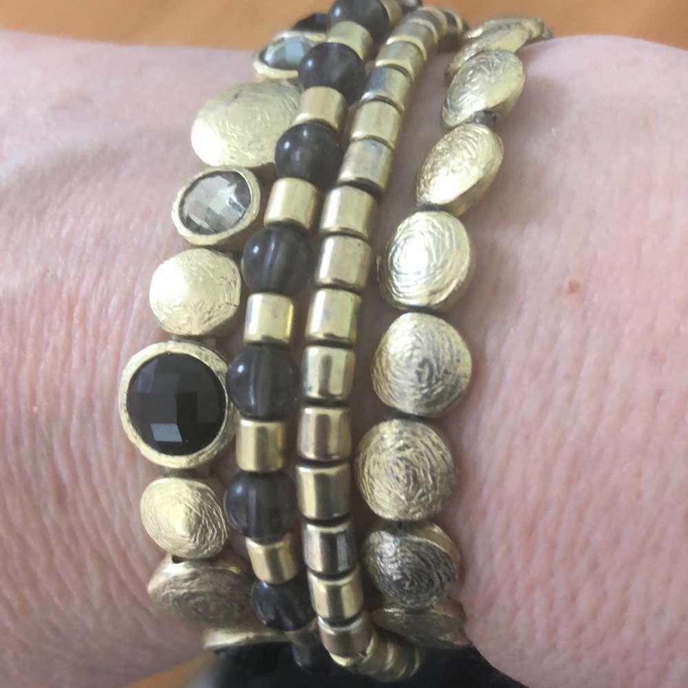Cookie Lee set of gold and black tone bracelets